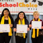 professional women holding school choice placards