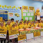 students wearing yellow holding school choice signs