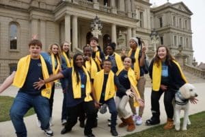 students in yellow scarves at the capitol