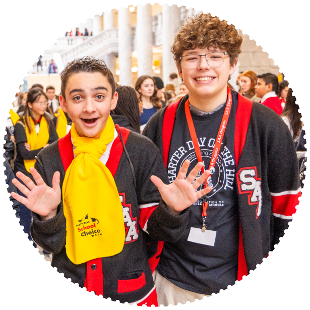 Two students pose for the camera at a capitol rally in Utah