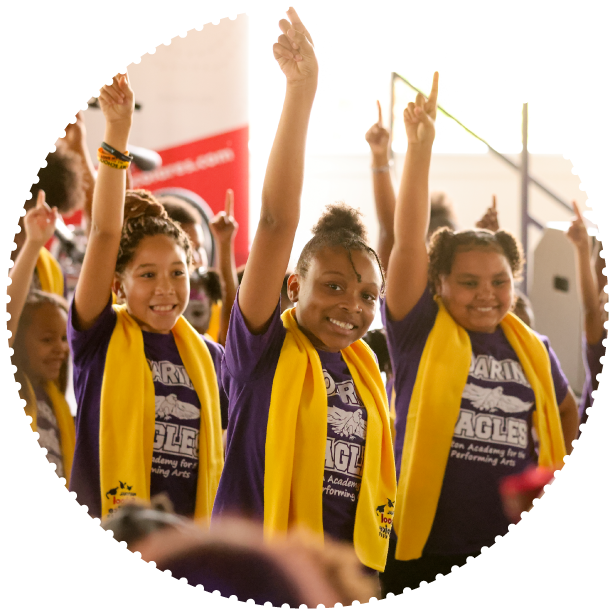 A group of students wearing School Choice Week scarves pose for a photo