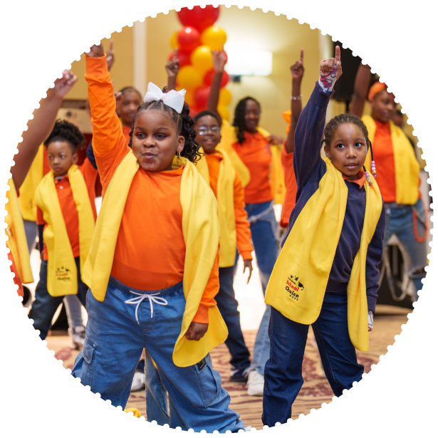 A group of students dance at an event